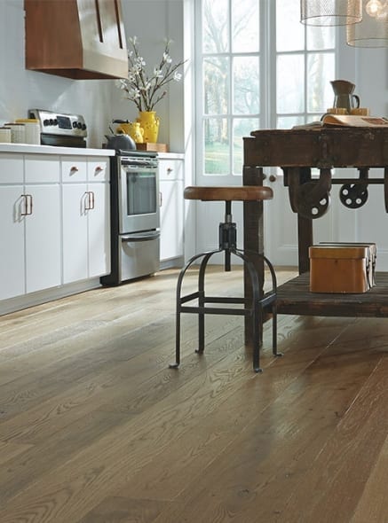 White Kitchen with Brown Textured Hardwood Floors