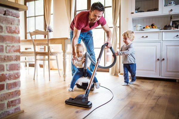 Family cleaning their hardwood floors